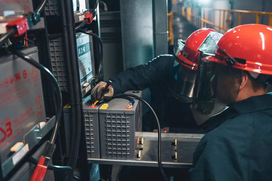 Dayton Power & Controls electrician working on control panel wiring