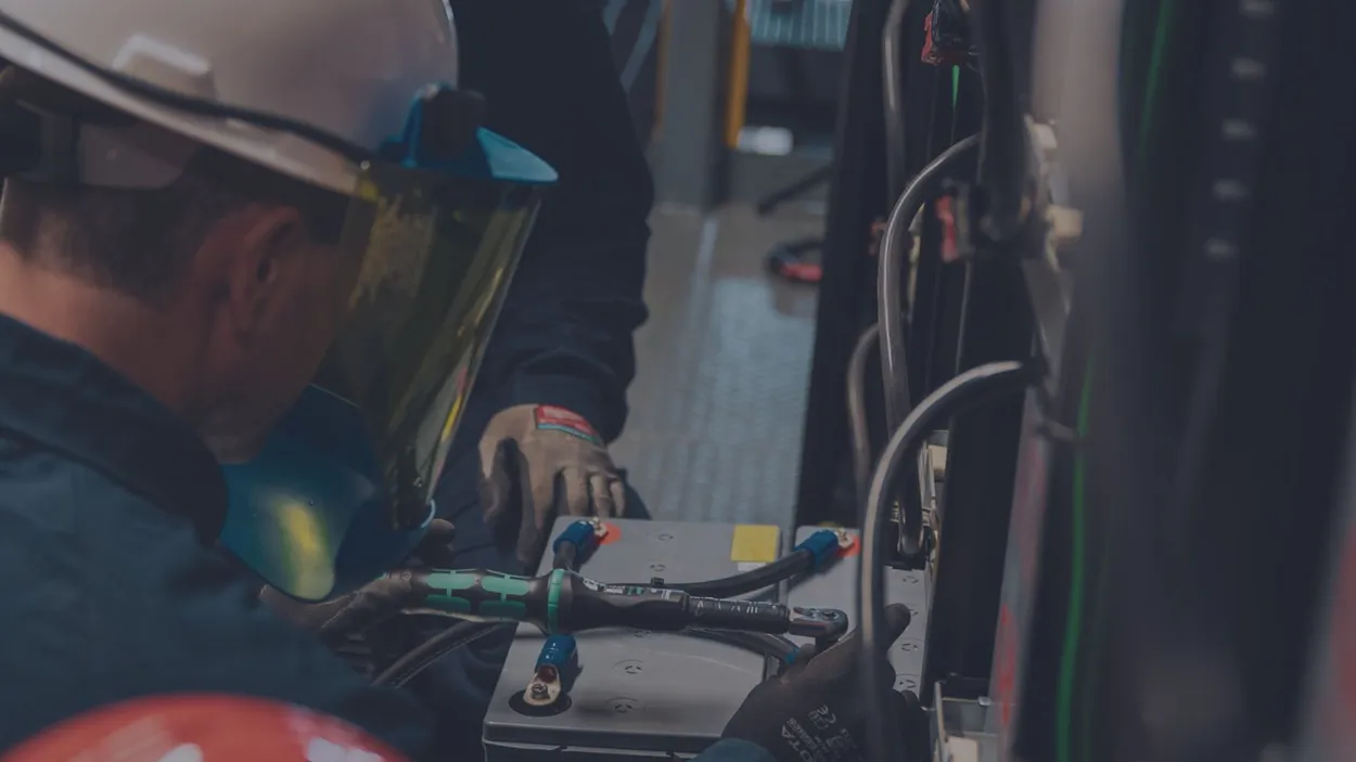 Dayton Power & Controls electrician working on control panel wiring