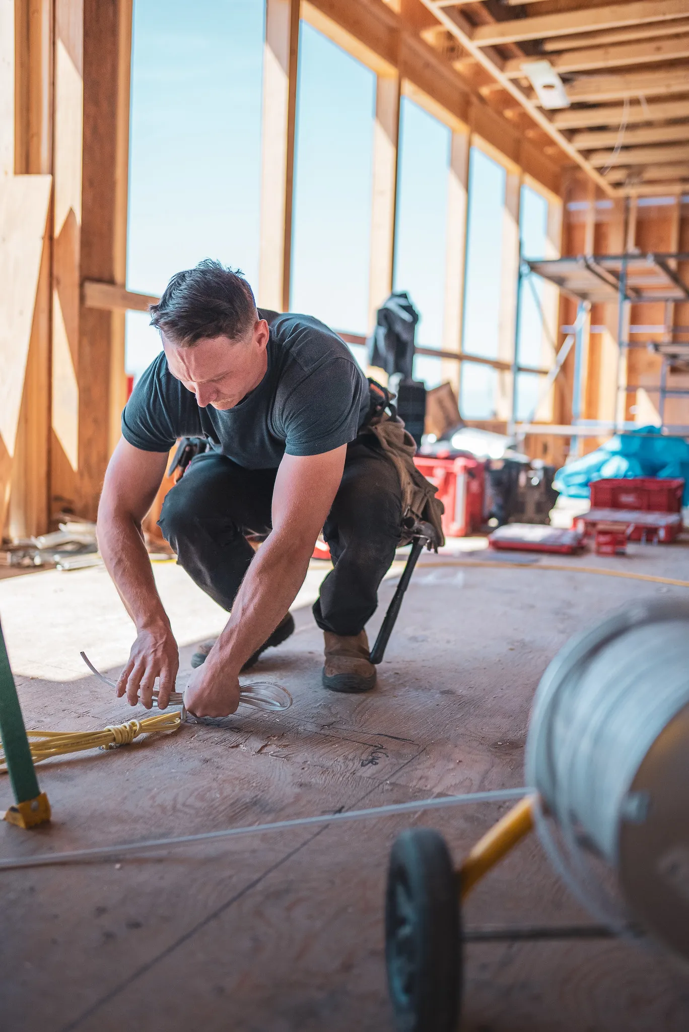 Electrical contractor working on construction site